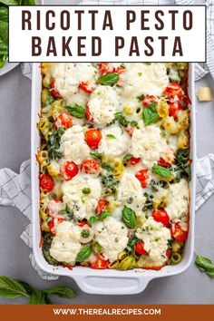 a casserole dish filled with ricotta and spinach, topped with fresh basil