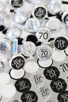 there are many different types of candies on the table, including one for 70th birthday