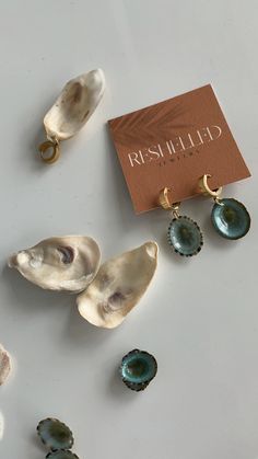 The Costa Shell Earrings are made with teal shells found in Costa Rica. The shells hang from stainless steel, gold hoops. * All shells vary Sea Jewelry, Seashell Earrings, Seashell Jewelry, Ocean Jewelry, Jewelry Lookbook, Shell Jewelry, Shell Earrings, Add Ons, Jewelry Inspo