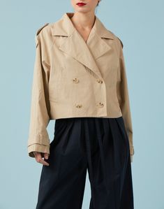 The Sydney Cropped Trench is a cotton twill jacket with all the details of a classic trench coat, but with a cropped fit. Features a notched lapel collar, double breasted closure, and shoulder tab details. The perfect not-too-cropped length make this the perfect and easy piece! Fit + Measurements Length =25" (from shoulder) Measurement taken from size Small Margarita is 5'8 1/2" and is wearing size Small Fits true to size Cropped Trench Coat, Cotton Trench Coat, Cotton Twill Jacket, Khaki Trench, Khaki Trench Coat, Classic Trench Coat, Twill Jacket, Khaki Color, Contemporary Fashion