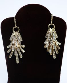 Vintage gold tone and clear rhinestone hook dangle earrings, In good vintage condition, It's 2" long. Thanks. Evening Diamond Dangle Crystal Earrings, Gold-tone Glamorous Earrings For Formal Occasions, Sparkling Stones Dangle Linear Earrings For Evening, Glamorous Gold-tone Formal Earrings, Sparkling Dangle Linear Earrings For Evening, Evening Linear Dangle Earrings With Sparkling Stones, Sparkling Stone Dangle Earrings For Evening, Glamorous Gold-tone Earrings For Formal Occasions, Gold Diamond Chandelier Earrings With Sparkling Stones