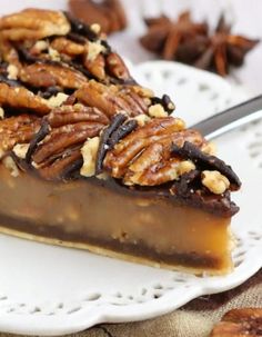 a slice of pecan pie on a white plate