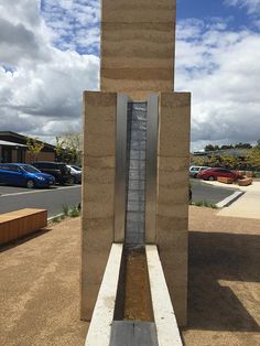 a water fountain in the middle of a parking lot