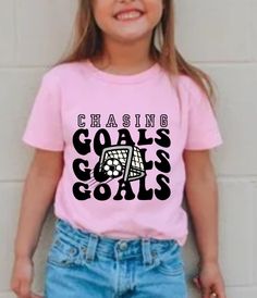 Welcome and thank you for choosing KayReneeDesign my online Etsy store for custom designs, gifts, and apparel💐 Cute trendy custom soccer t-shirt for girls soccer team. Whether for your daughter, niece, sister or cousin this would make a great t-shirt to represent the soccer player in and out of the game! Feel free to message me with any questions you may have. If you are ordering 5 or more at a time be sure to message me before you checkout for a discount code.  HOW TO ORDER:  Select size and c Pink Team Spirit T-shirt With Graphic Print, Casual Pink Sublimation T-shirt With Letter Print, Casual T-shirt For Cheerleading, Pink Letter Print T-shirt For Cheerleading, Pink T-shirt With Team Name For Cheerleading, Pink School Spirit T-shirt With Name Print, Girls Soccer Team, Soccer Event, Soccer Outfit