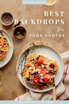 two plates with spaghetti and tomatoes on them