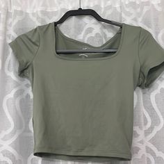 Never Worn! Army Green Color Spring Workout Tops With Short Sleeves, Spring Workout Short Sleeve Tops, Scoop Neck Spring Workout Top, Green Workout T-shirt For Spring, Basic Green Cropped Top, Casual Cropped Workout Tops, Spring Workout Cropped T-shirt, Green Crop Top For Workout, Green Workout Crop Top