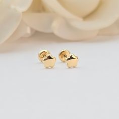 Delight in the charm of our Baby Flower Polished Stud Earrings. Crafted from 14k gold, these adorable earrings feature a delicate flower design and secure Spanish backings, perfect for little ears. Features: Material: High-quality 14k gold for a beautiful, lasting shine. Design: Cute flower shape with a polished finish. Post Size: .08mm, strong and comfortable ideal for baby ears. Why You'll Love Them: Adorable Design: Sweet flower shape that complements any outfit. Durable: Made to withstand everyday wear. Treat your little one to these precious Baby Flower Polished Stud Earrings. Order now and add a touch of elegance to their everyday look. Briza Collections is a small family owned business that works hard on providing the best selection of Fine Solid Gold Jewelry for the best prices. Ou 14k Gold Earrings With Flower Charm For Gift, 14k Yellow Gold Round Flower Earrings, Yellow Gold 14k Round Flower Earrings, 14k White Gold Flower-shaped Earrings, Dainty Yellow Gold Earrings With Flower Charm, Hypoallergenic 14k Gold Flower-shaped Jewelry, 14k Gold Flower Charm Earrings, Yellow Gold Earrings With Flower Charm For Gift, Yellow Gold Earrings With Flower Charm As Gift