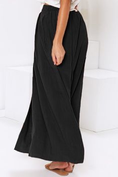 Black Buttoned Maxi Skirt Black Lined Relaxed Skirt Bottoms, Wide Leg Lined Skirt, Relaxed Black Maxi Skirt, Black Relaxed Maxi Skirt, Casual High Waist Black Maxi Skirt, Black Skirted Bottoms, Casual Black Flared Skirt Bottoms, Black Full-length Relaxed Skirt, Black Skirt With Elastic Waistband For Beach