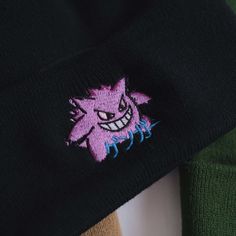 ゲンガ means GENGAR... A great gift or piece for winter wear. Direct embroidery, only available here at Embroidered Dad Hats! 🧢• Embroidered on a soft acrylic beanie.• Adult, one size fits all.• Free poly-bag shipping in 🇺🇸 (more options at checkout). Winter Embroidered Cotton Hat, Winter Embroidered Beanie One Size, Winter Embroidered Beanie, One Size Fits Most, Winter Embroidered Beanie One Size Fits Most, Embroidered Cotton Beanie, One Size Fits Most, Embroidered Cotton Beanie One Size, Embroidered Cotton Beanie, Embroidered Cotton Beanie One Size Fits Most, Embroidered Cotton Beanie (one Size Fits Most)