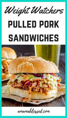 two pulled pork sandwiches with coleslaw and slaw on the side, in front of