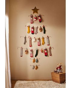 a christmas tree made out of stockings hanging from clothes pins