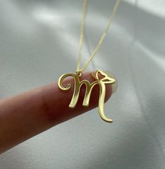 M Gold Pendant, Gold Initial Letter Necklace For Valentine's Day, Elegant Initial Pendant Necklace For Mother's Day, Gold Initial Pendant Name Necklace For Mother's Day, Gold Letter Initial Necklace As Personalized Gift, Elegant Initial Pendant Necklace As Gift, Elegant Gold Initial Necklace With Name Detail, Elegant Charm Necklace With Birth Flower And Initial Pendant, Elegant Gold Initial Necklace With Custom Name