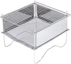 a metal basket with wire on the top and bottom, holding a tray for food