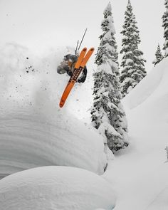 a person jumping in the air while riding skis