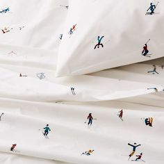 white sheets with skiers printed on them