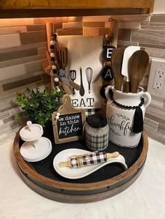 kitchen utensils are arranged in a tray on the counter