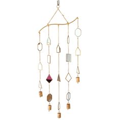 a wind chime hanging from a chain with different shapes and colors on it's sides