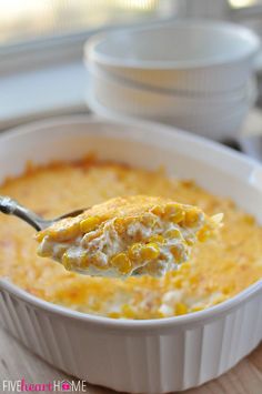 a spoon full of cheesy corn casserole