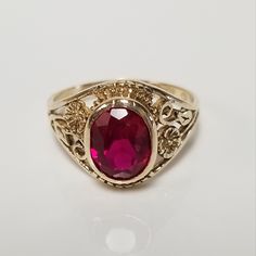 Thanks for shopping our vintage estate store. We tend to sell well below wholesale and truly hope you enjoy all of our items. Many of the items are one of a kind, so please enjoy scrolling through the pictures and hopefully something will catch your eye. Estate 10k yellow gold created .50ct ruby vintage filigree ring. Beautiful ring and will make a nice present. Ruby is oval created. Ring size: 4.5 Setting: 3/8" 8mm Band width: 1.5mm Weight: 2.01 grams Beautiful ring. Marked 10k. Cheap Antique Oval Jewelry, Classic Oval Ruby Ring, Classic Oval Ruby Ring With Diamond Cut, Oval Signet Ring With Intricate Design For Anniversary, Vintage Yellow Gold Ruby Ring With Diamond Cut, Vintage Oval Signet Ring With Intricate Design, Classic 14k Gold Filigree Ring In Oval Shape, Estate Style 14k Gold Oval Jewelry, Vintage Oval Diamond Cut Signet Ring