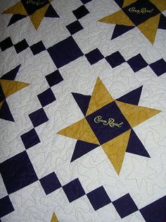 a quilt with gold and blue stars on it that says, god's love