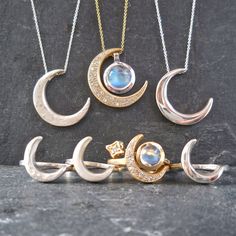 "This unique crescent moon phase pendant is available in silver or 14 k gold. So beautiful polished but equally stunning hand-finished matte, hammered or have it encrusted with diamonds. A focal piece that can be stacked with smaller pendants. It's a slide providing space for a pendant to fit into the opening. We've paired it with our bezel set moonstone. crescent moon 24 millimeters long x 19 mm wide or/ almost 1\" long x 3/4\" wide 14k solid gold or sterling silver pave Diamond encrusted Cresc Fine Jewelry Diamond Moon Phase, Luxury Sterling Silver Moon Charm Jewelry, Luxury Sterling Silver Jewelry With Moon Charm, Fine Diamond Moon Shaped Jewelry, Diamond Moon Phase Round Pendant Jewelry, Fine Jewelry White Gold With Moon Phase, Fine Jewelry In White Gold With Moon Phase, Fine Jewelry In White Gold With Moon Phase Detail, Luxury Silver Crescent Jewelry