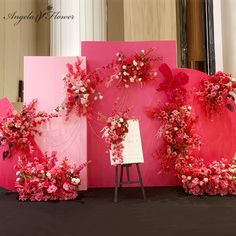 pink and white flowers are on display in front of an art piece that says happy valentine's day