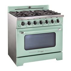 a green stove with four burners and two oven doors on each side, in front of a white background