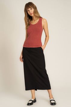 This tank is the best of both worlds.Our Cooper Sweater Rib Tank is the perfect blend of the comfort and fabric of your favorite sweater with the flattering fit of your go-to tank top. The wide rib fabric, scoop neck, and fitted silhouette keep this tank looking structured while still feeling comfy. Dress up with leather pants and heels for a night out or keep it casual with jeans for a weekend vibe. 94% Cotton4% Polyester2% Spandex Care Instructions: Machine wash cold. Wash inside out with simi Chic Ribbed Crew Neck Tank Top, Chic Ribbed Scoop Neck Tank Top, Fall Crew Neck Tank Top For Everyday, Casual Crew Neck Ribbed Tank Top, Casual Crew Neck Tank Top With Ribbing, Casual Ribbed Tank Top For Spring, Casual Ribbed Tank Top For Layering, Chic Scoop Neck Tank Top For Fall, Casual Seamless Tops For Work