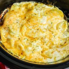 a crock pot filled with macaroni and cheese