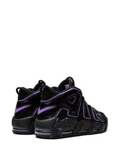 the nike air more uptempose is shown in black and purple tones, with an upper