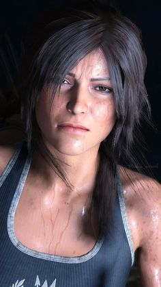 an image of a woman with wet hair and blue tank top looking at the camera