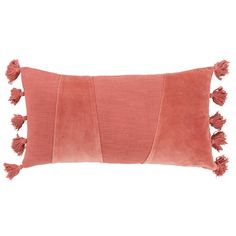 an orange pillow with tassels on the front and back, against a white background