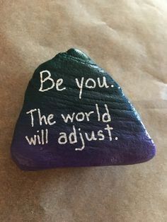 a rock with writing on it that says be you the world will adjut