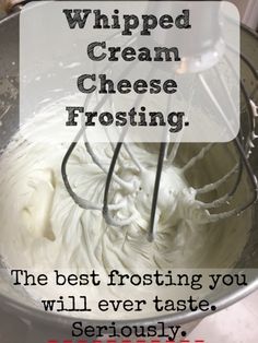 whipped cream in a mixing bowl with the words whipped cream cheese frosting