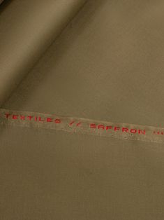 the fabric has red writing on it that says, textiles / sapron inc '