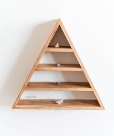 a wooden shelf with three shelves on each side