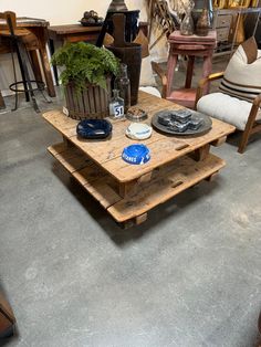 a living room filled with furniture and lots of wood pieces on top of each other