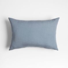 a light blue pillow on a white background