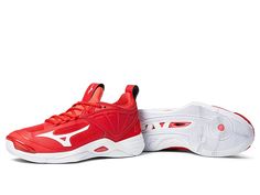 a pair of red and white tennis shoes