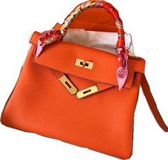 Designer Orange Shoulder Bag For Daily Use, Orange Top Handle Shoulder Bag For Shopping, Designer Orange Bags For Formal Occasions, Designer Orange Satchel For Travel, Formal Orange Satchel With Detachable Strap, Orange Top Handle Shoulder Bag Gift, Designer Orange Bags As Gifts, Formal Orange Bag With Detachable Strap, Formal Orange Top Handle Shoulder Bag