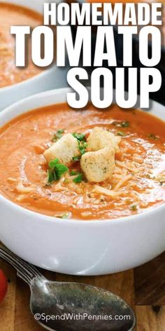 a bowl of fresh tomato soup with croutons and parmesan bread on the side