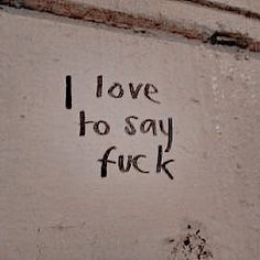 graffiti written on the side of a building that says i love to say f k