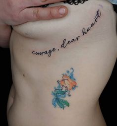 a woman's stomach with the words courage, dear heart written on her side