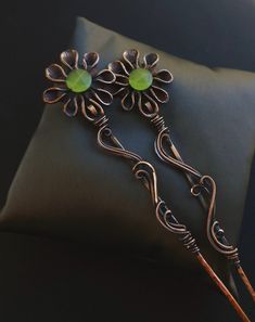 "Handmade wire wrapped copper hair stick set  prehnite chalcedony gemstone, faceted circles  copper wire hand formed and hammered texture  oxidized for an antiqued finish, tumbled and polished to a high shine  copper floral charms  7\" total length  great for hair up do's and buns  comes nicely packaged with a business card, jewelry care instructions and a polishing cloth" Hair Wire Wrap, Metalsmithing Jewelry, Copper Hair, Handmade Wire Wrapped, Jewelry Care Instructions, Mini Things, Hair Sticks, Hair Art, Hair Jewelry