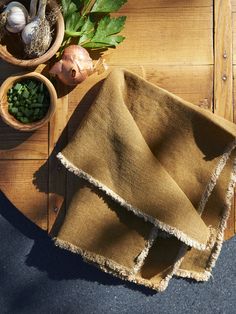 some vegetables are sitting on a wooden table