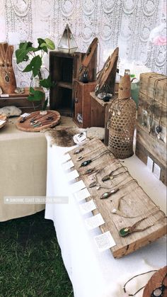 the table is set up with various items on it and there are also wooden boxes