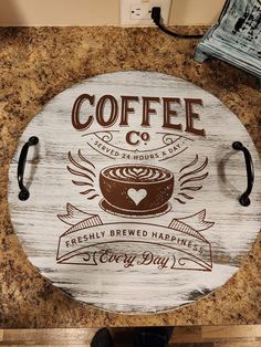 a wooden sign that says coffee and has a pot on it