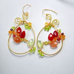 Indulge in the boho chic charm with these large teardrop multi gemstones earrings, featuring carnelian, sunstone, prehnite, citrine, garnet and peridot.  These handmade, colorful flower woven hoops make a unique gift for her. Perfect for any jewelry lover, these luxury gem wire-weaved earrings are a statement piece that blends whimsy with elegance. ▶️ Natural multi gemstone weaved earrings length - approx. 2.5 x 1.25 inch / 6,5x 3,2 cm ▶️ MATERIAL: ◾️ 18K gold plated textured wire and finish, ox Unique Dangle Earrings With Gemstone Beads, Unique Wire Wrapped Dangle Jewelry, Bohemian Teardrop Wire Wrapped Jewelry, Bohemian Wire Wrapped Teardrop Jewelry, Handmade Bohemian Briolette Earrings, Carnelian Wire Wrapped Earrings As Gift, Carnelian Wire Wrapped Earrings For Gift, Gift Carnelian Wire Wrapped Earrings, Handmade Bohemian Teardrop Jewelry