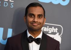 a man in a tuxedo and bow tie smiling for the camera at an awards event