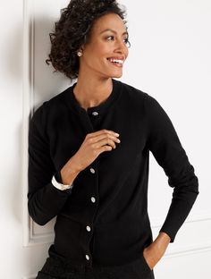 Take along an elegant finishing touch with this classic cardigan. Made from an exceptionally smooth cotton blend with rib knit trim. Stay cozy in style at all your parties and happy occasions. Features Cardigan Long Sleeve Hits At Hip Crew Neck Button front closure Straight hem Imported Fit: Misses: 22 1/2"; Petite: 21 1/2"; Plus: 25 1/2" Material: 65% Cotton, 20% Polyester, 13% Nylon, 2% Spandex Care: Machine Wash Cold; Only Non-Chlorine Bleach When Needed; Reshape, Lay Flat To Dry; Cool Iron, Elegant Fitted Sweater With Ribbed Cuffs, Elegant Fitted Outerwear With Ribbed Cuffs, Classic Fitted Cardigan For Layering, Fitted Classic Cardigan For Layering, Elegant Winter Tops With Button Cuffs, Elegant Fitted Cardigan With Ribbed Cuffs, Classic Fitted Sweater For Layering, Classic Fitted Cardigan, Elegant Fall Cardigan With Button Cuffs